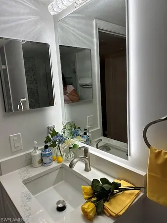 a bathroom with a sink and a mirror