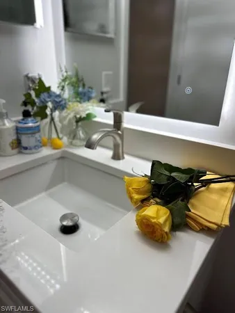 a kitchen with a sink and a stove