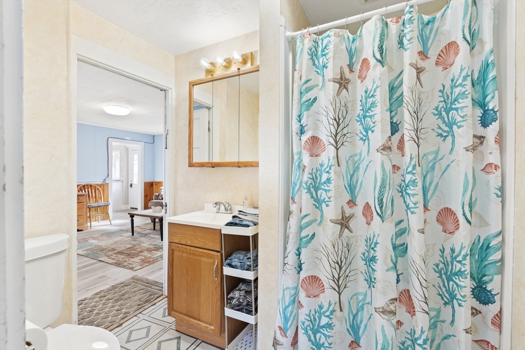 278 A Delano Road Marion, MA 02738 - Photo 20 of 32 a bathroom with a sink and mirror with curtain