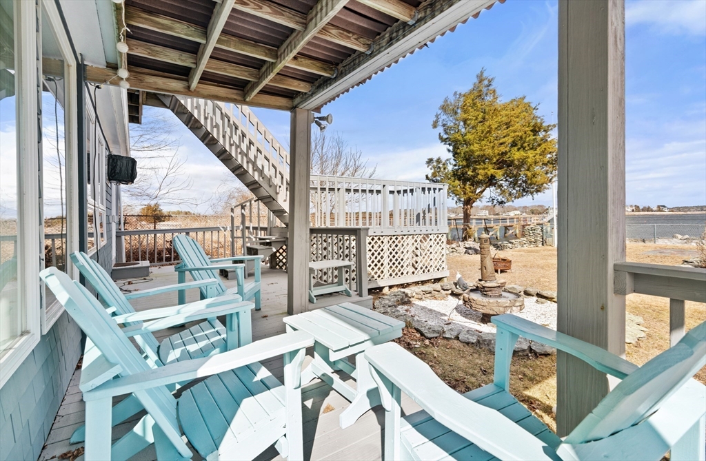 278 A Delano Road Marion, MA 02738 - Photo 29 of 32 a view of living room with furniture and a floor to ceiling window