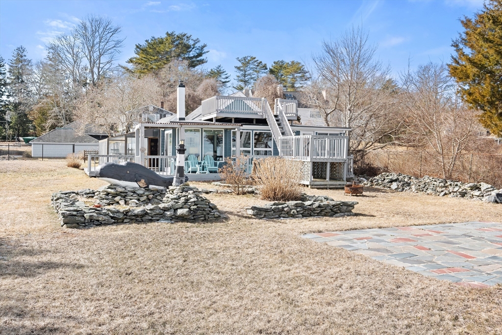 278 A Delano Road Marion, MA 02738 - Photo 30 of 32 a front view of a house with a yard covered in snow