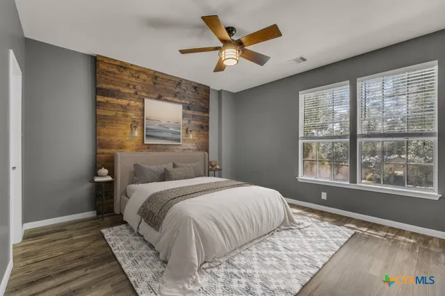 a view of swimming pool with wooden floor