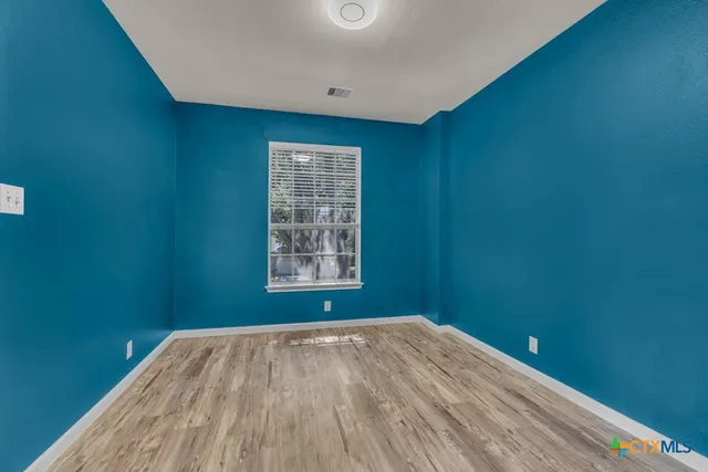 a view of a roof deck with furniture