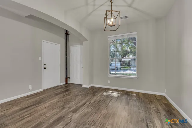a bathroom with double sink and a mirror