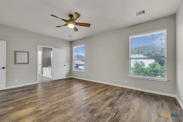 a backyard of a house with lots of green space