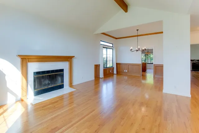 a view of an empty room and fire place