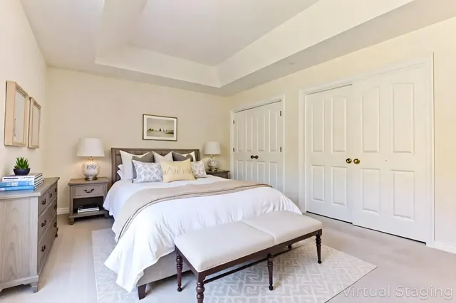 a bedroom with a bed and a table in it