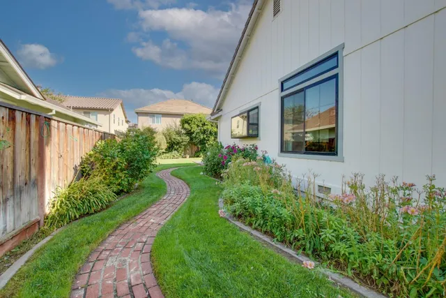a view of a house with a backyard