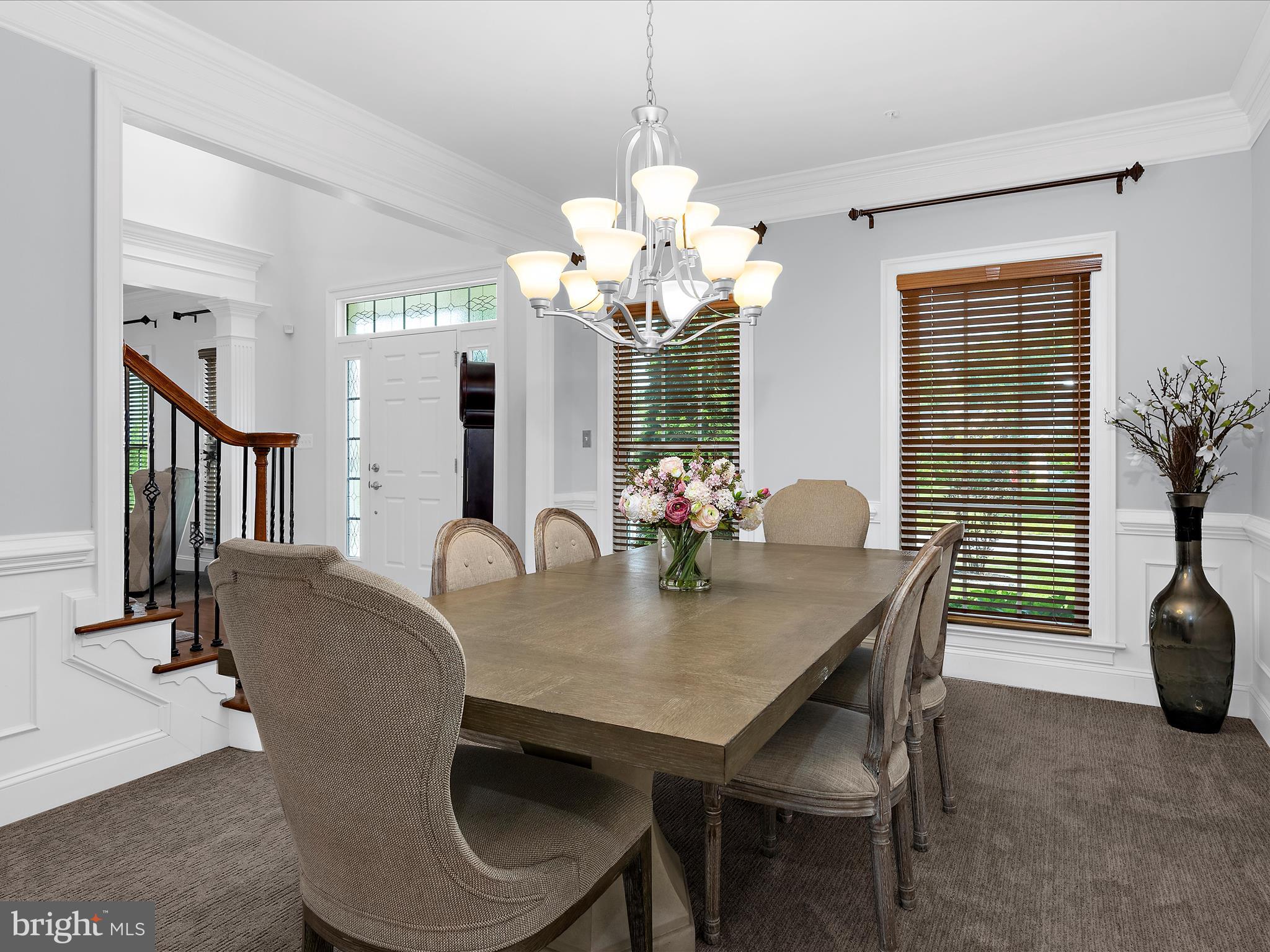 13801 Racetrack Field Court Bowie, MD 20720 - Photo 14 of 66 a view of a dining room with furniture and a chandelier