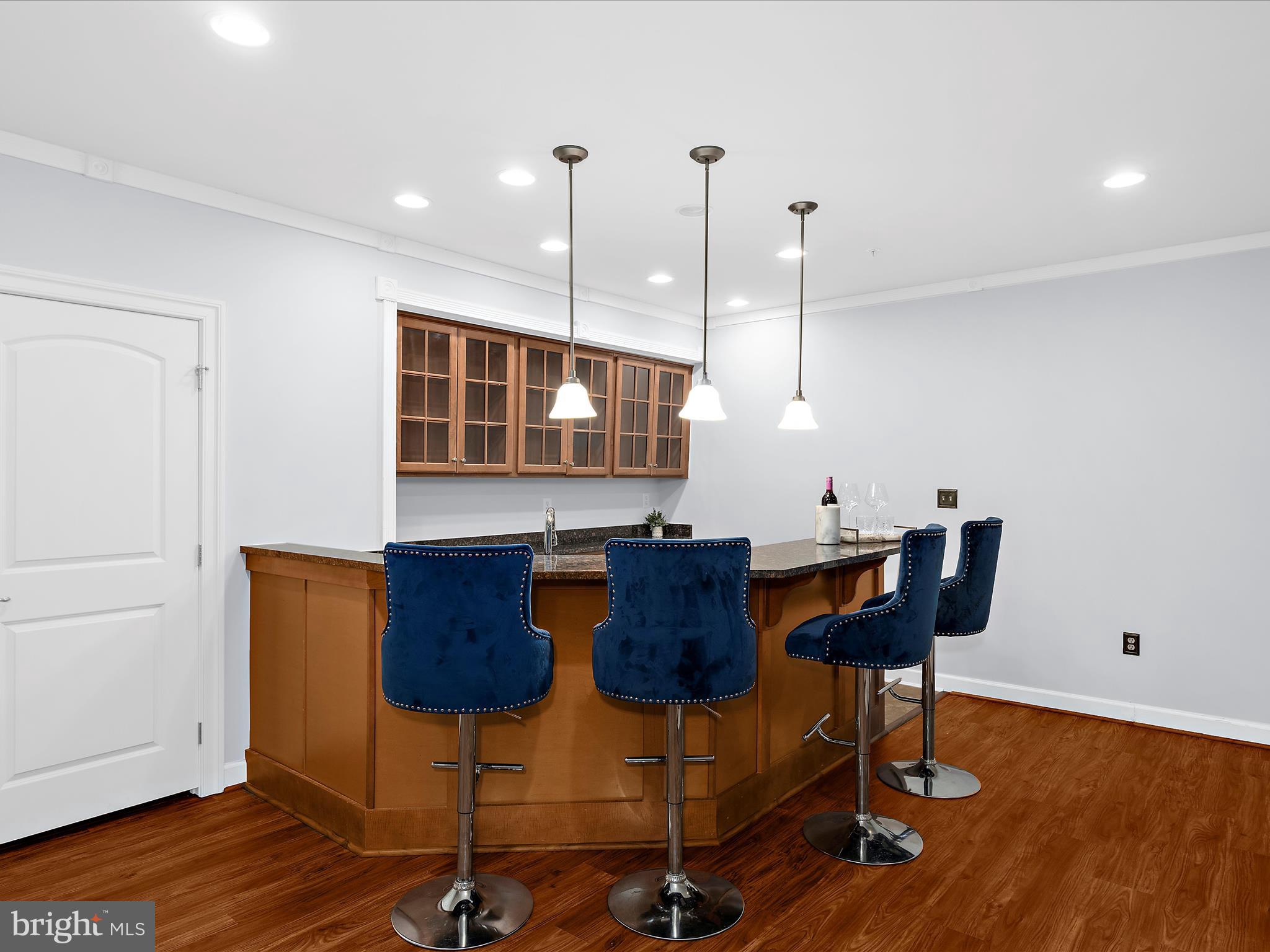 13801 Racetrack Field Court Bowie, MD 20720 - Photo 47 of 66 a view of a kitchen with furniture and wooden floor