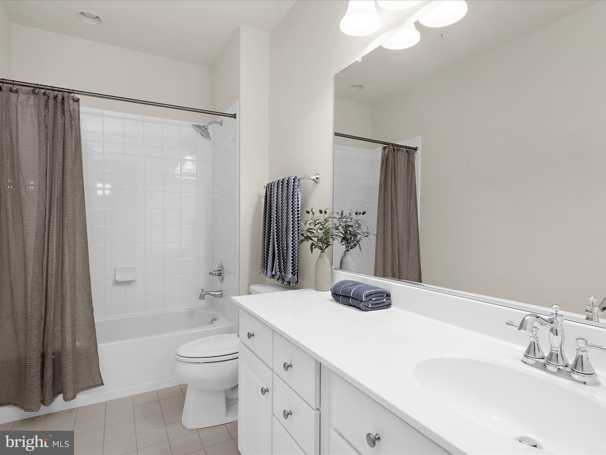 13801 Racetrack Field Court Bowie, MD 20720 - Photo 50 of 66 a bathroom with a granite countertop sink toilet and shower