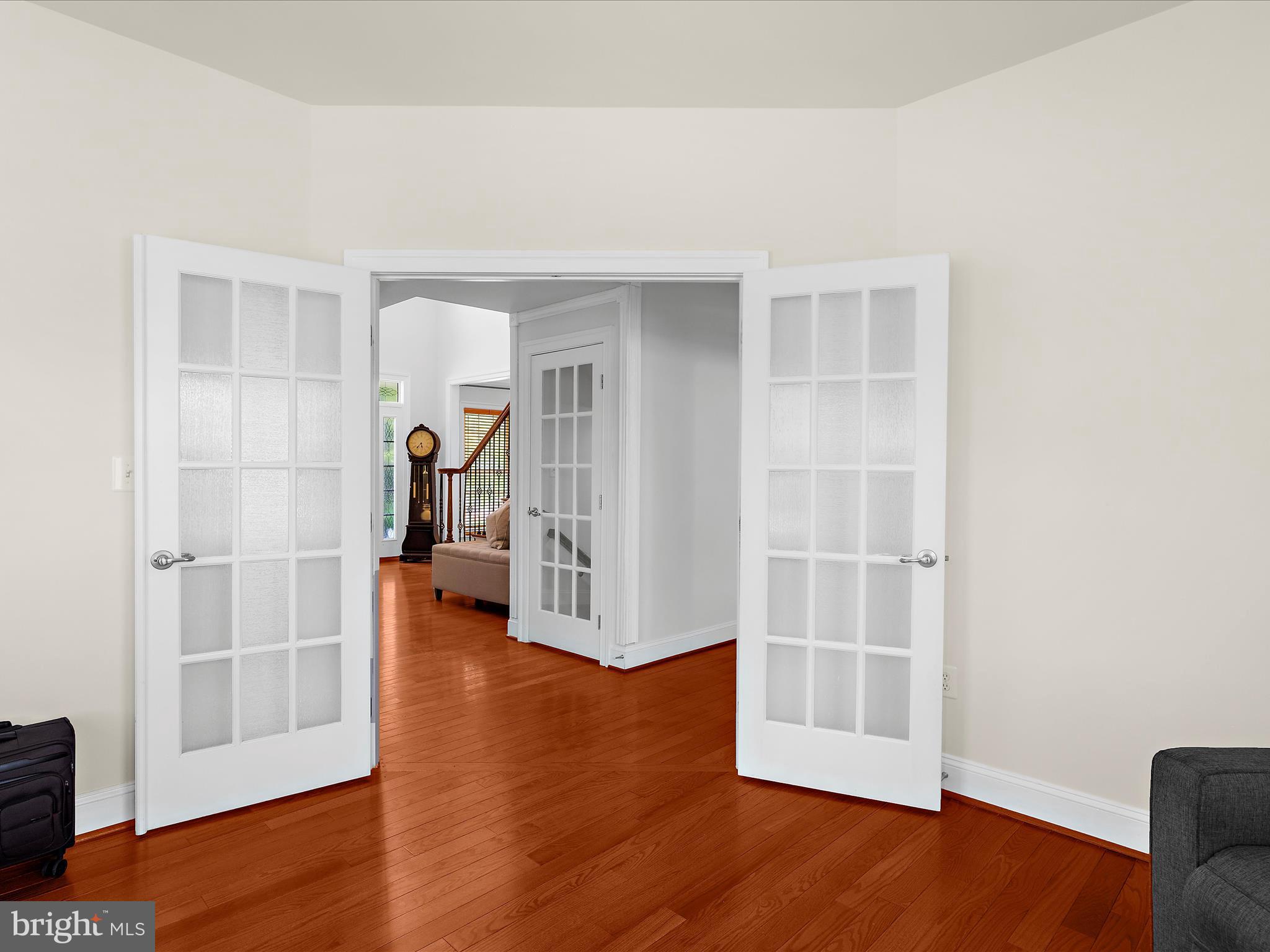 13801 Racetrack Field Court Bowie, MD 20720 - Photo 52 of 66 a view of a livingroom with wooden floor and a bookshelf