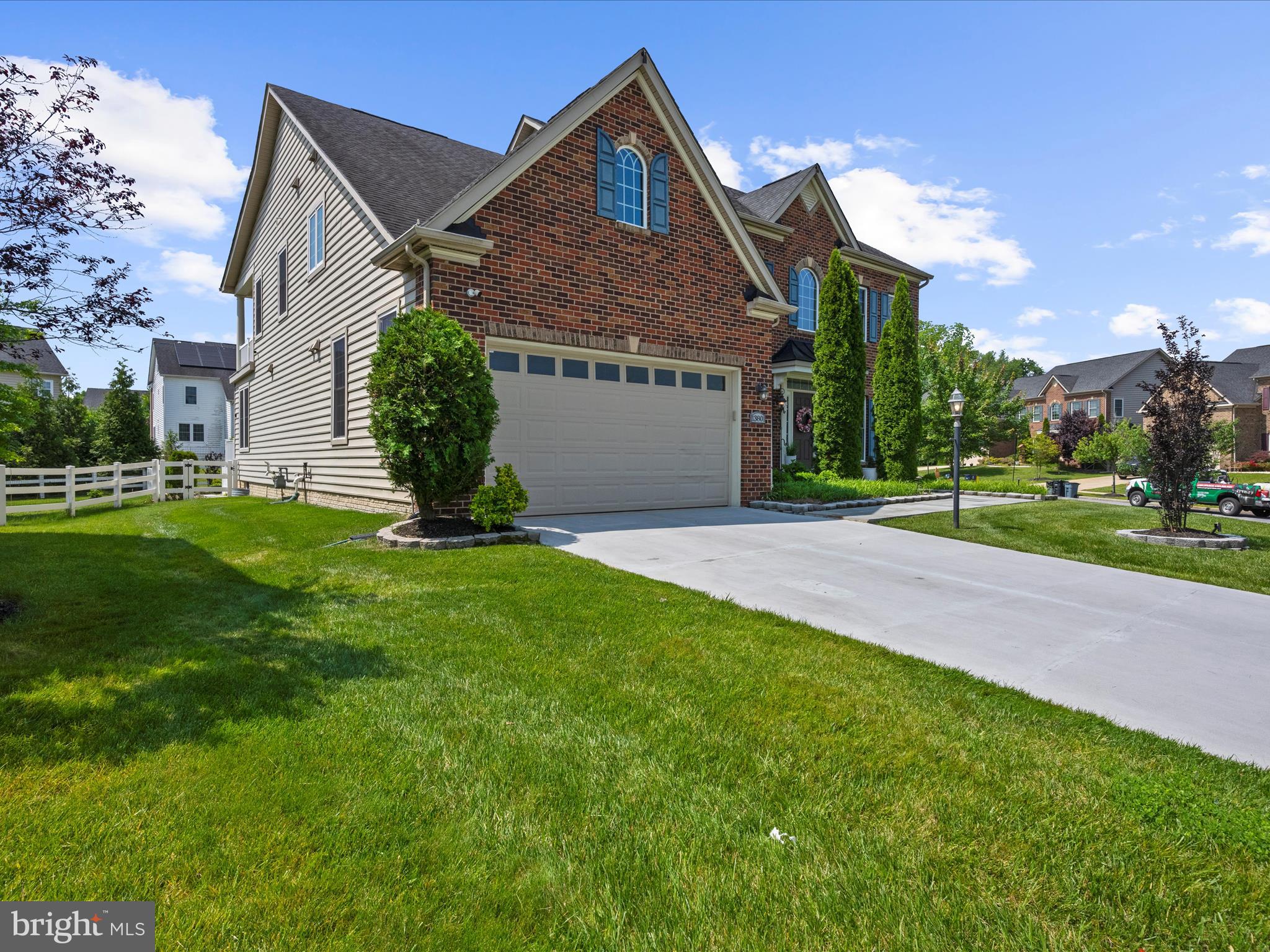 13801 Racetrack Field Court Bowie, MD 20720 - Photo 6 of 66 a front view of a house with a yard and trees