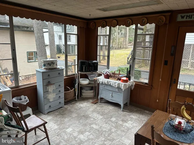 a room with furniture a rug and a window