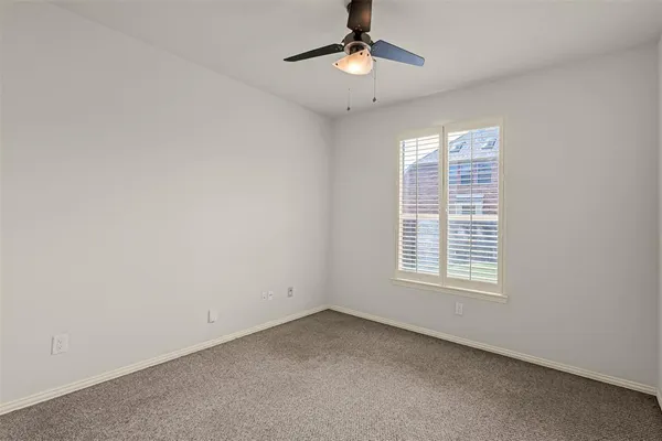 a view of small space with wooden floor and windows