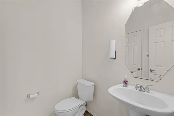 a view of a livingroom with wooden floor and a window