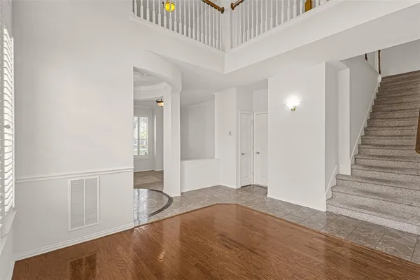 a view of empty room with a fireplace