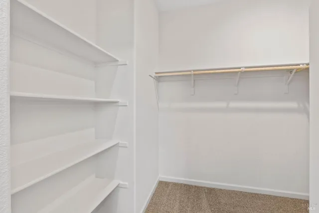 a view of an empty walk in closet