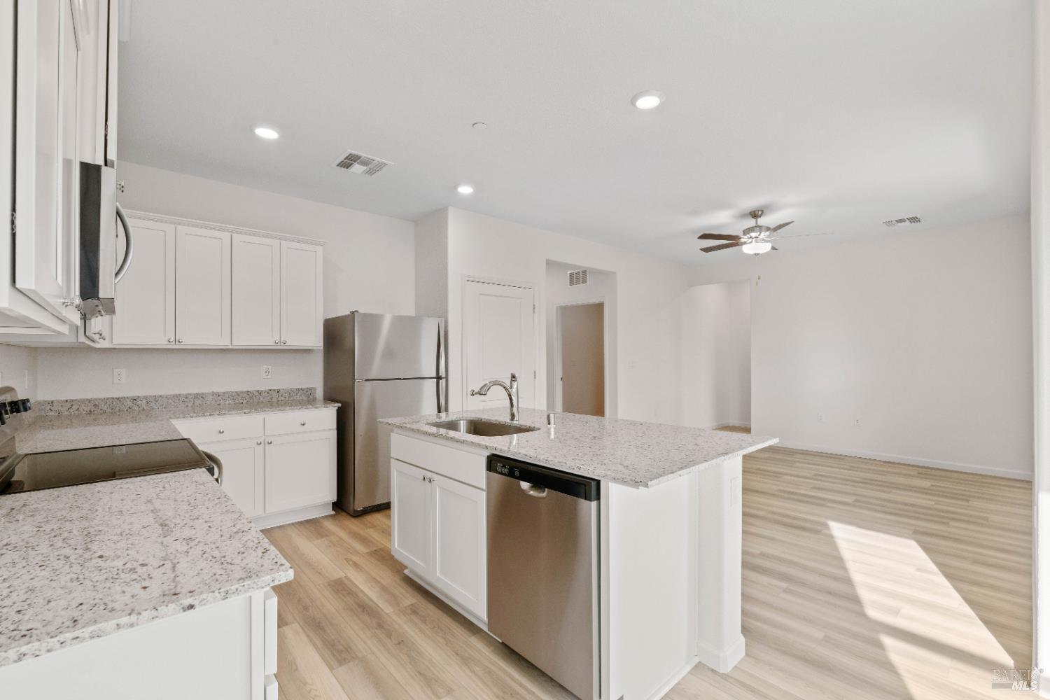 2241 Park Place Rio Vista, CA 94571 - Photo 9 of 17 a kitchen with granite countertop cabinets stainless steel appliances a sink and dishwasher