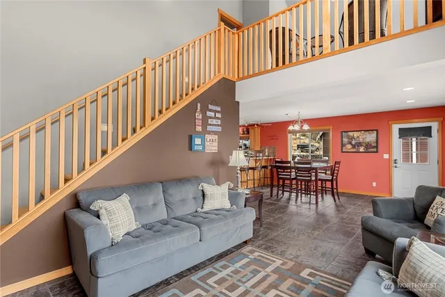 a living room with furniture and a dining space
