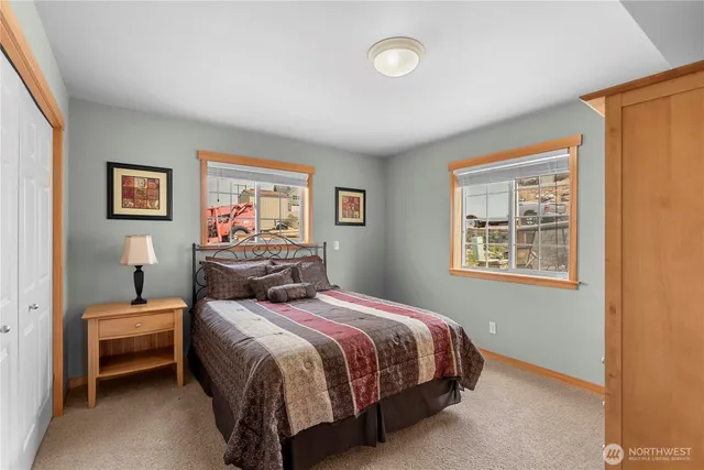 a bedroom with a bed and window