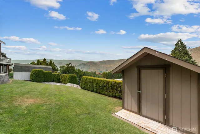 a view of an house with backyard space and garden