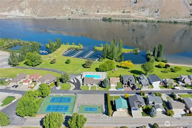 an aerial view of a house with a lake view