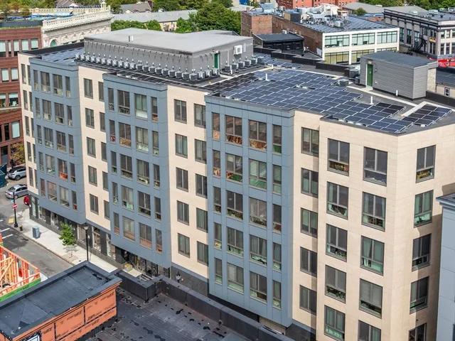 a view of a building with sitting area