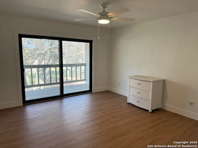 a spacious bathroom with a double vanity sink and mirror