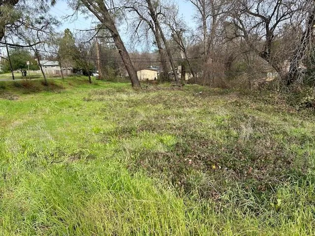 a fire hydrant in the middle of a field