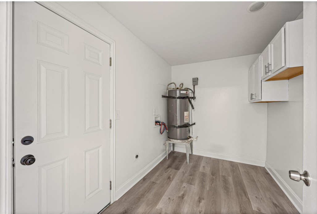 6410 Hartwick Road Houston, TX 77016 - Photo 8 of 16 a view of entryway with wooden floor