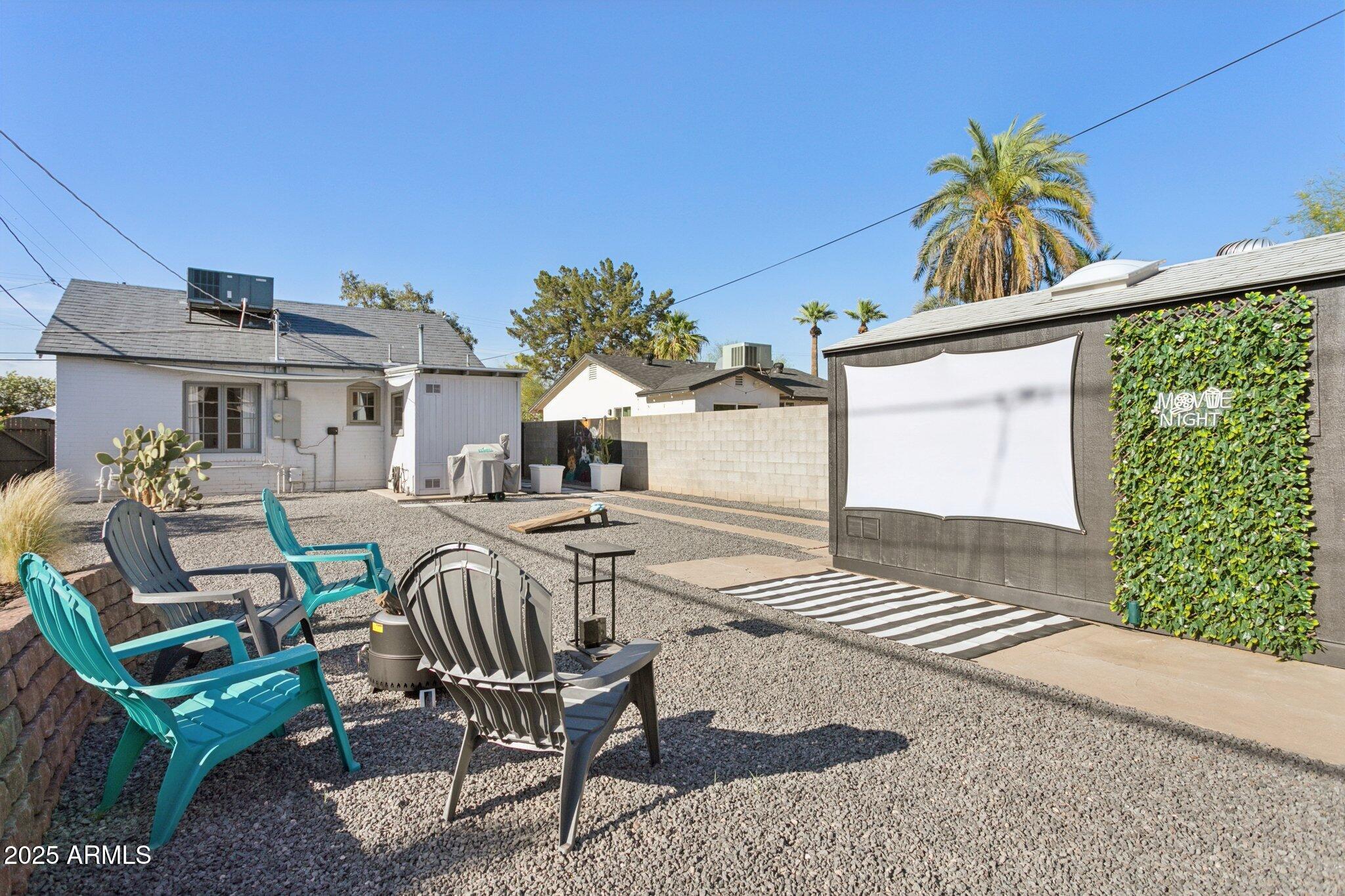 1111 East Coronado Road Phoenix, AZ 85006 - Photo 22 of 77 a view of a patio with table and chairs and potted plants