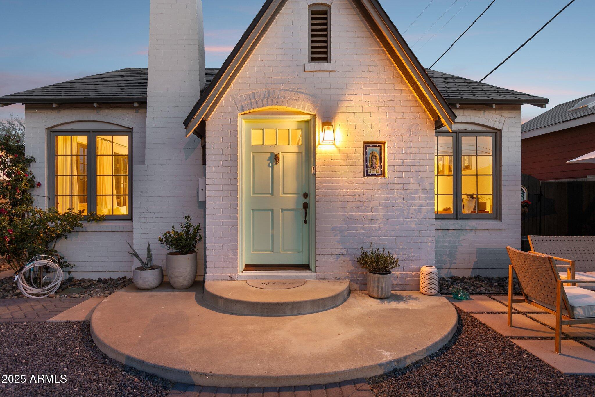 1111 East Coronado Road Phoenix, AZ 85006 - Photo 28 of 77 a view of a house with backyard sitting area and glass windows