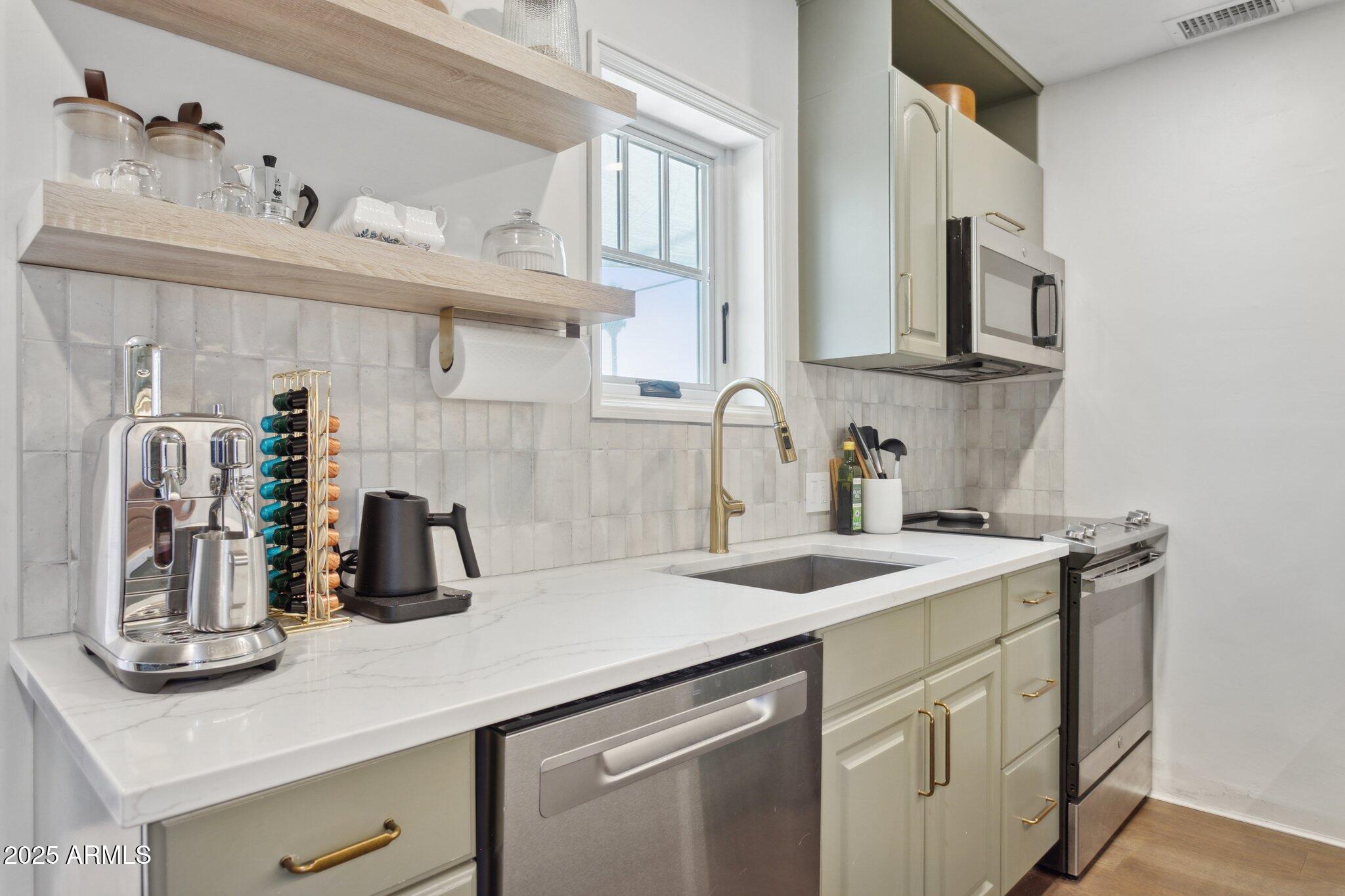 1111 East Coronado Road Phoenix, AZ 85006 - Photo 41 of 77 a kitchen with a sink dishwasher and cabinets with wooden floor