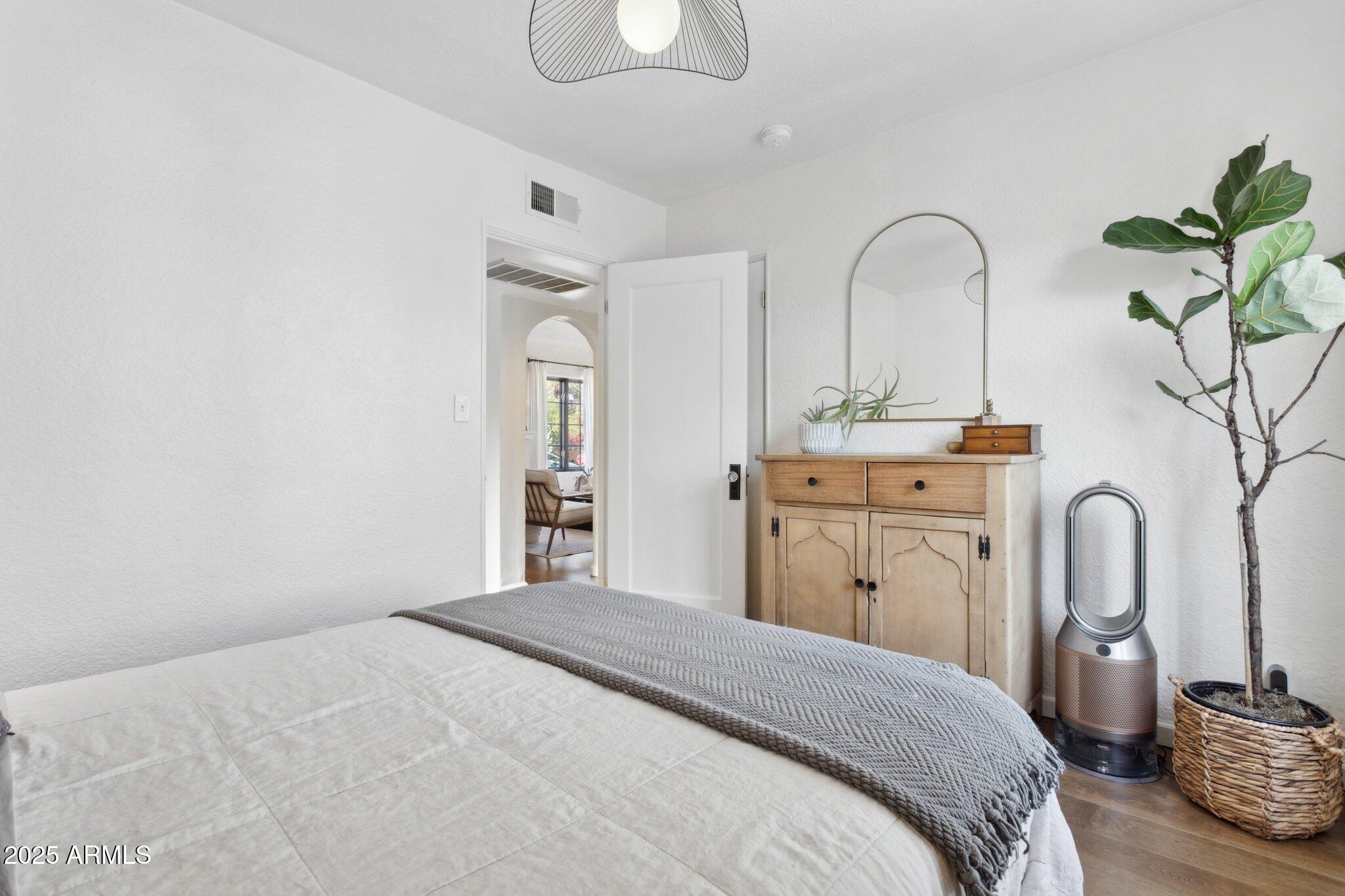 1111 East Coronado Road Phoenix, AZ 85006 - Photo 47 of 77 a bedroom with bed and a potted plant