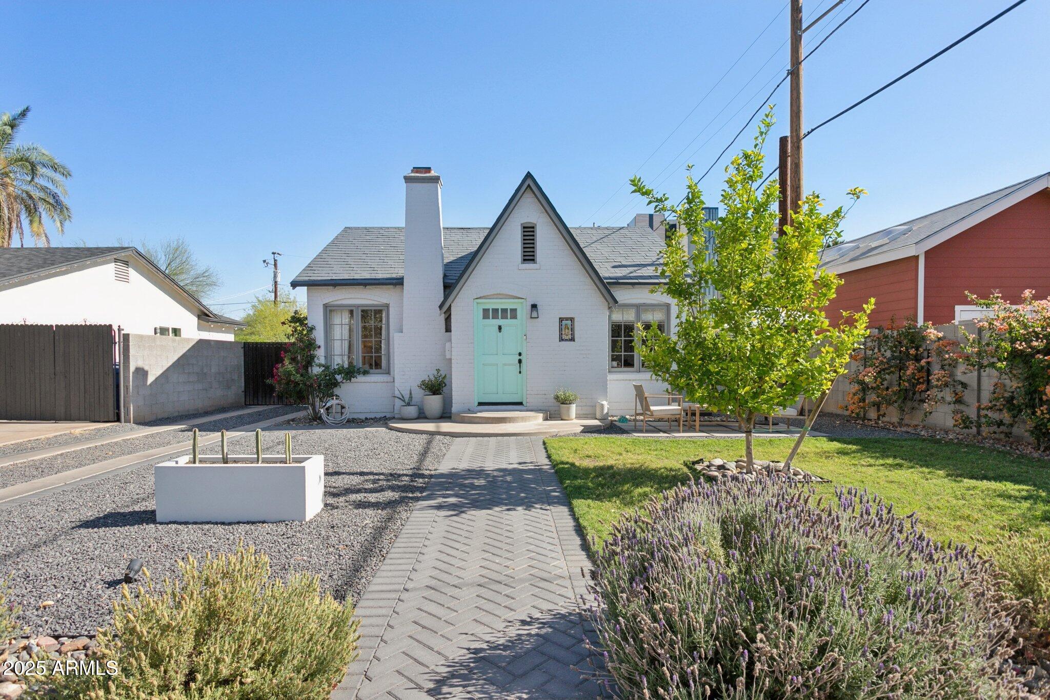 1111 East Coronado Road Phoenix, AZ 85006 - Photo 3 of 77 a front view of a house with a yard