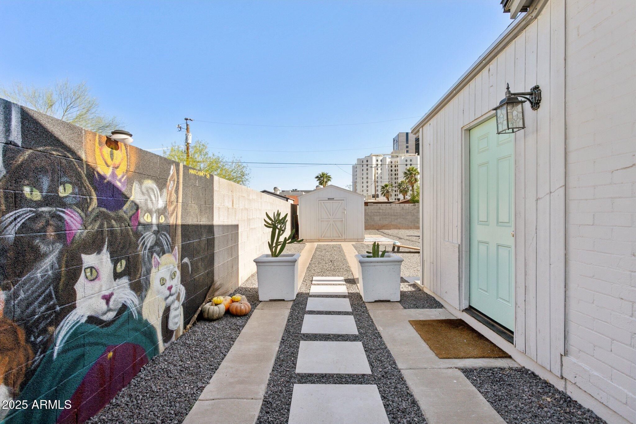 1111 East Coronado Road Phoenix, AZ 85006 - Photo 59 of 77 a view of a house with a door and a rug