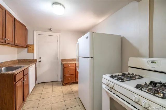 a kitchen with a stove a refrigerator and a stove