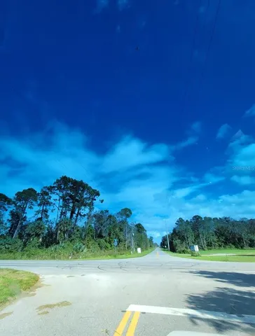 a view of a pathway with a ocean view
