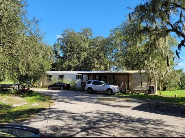 a view of yard with car parked