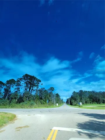 a view of a road with a yard