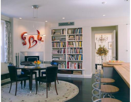 40 Cottage Street Brookline, MA 02445 - Photo 8 of 17 a dining room with furniture a book shelves and wooden floor