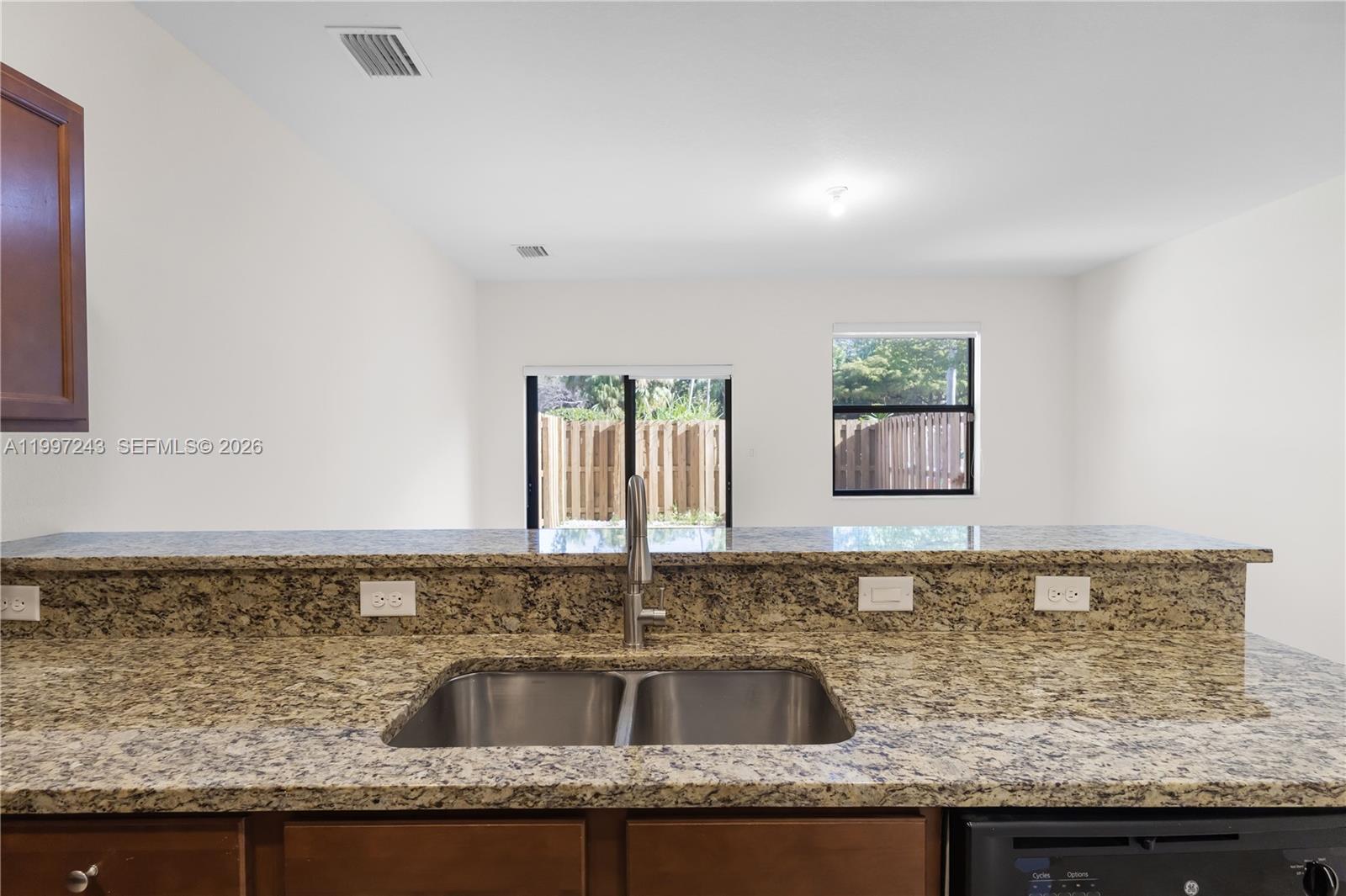 15075 Southwest 113th Terrace Miami, FL 33196 - Photo 12 of 36 a kitchen with granite countertop a sink and a granite counter tops