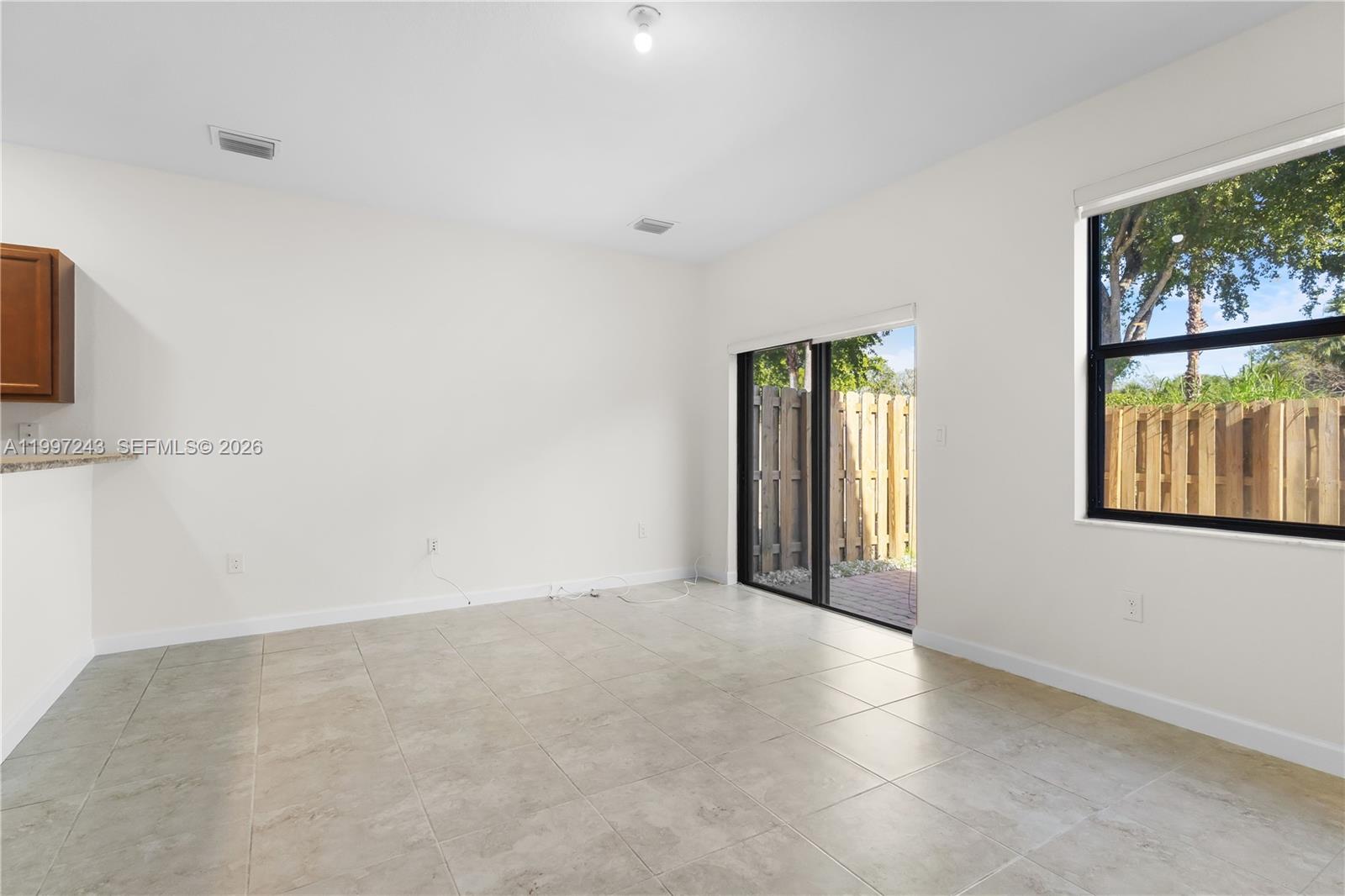 15075 Southwest 113th Terrace Miami, FL 33196 - Photo 14 of 36 an empty room with windows