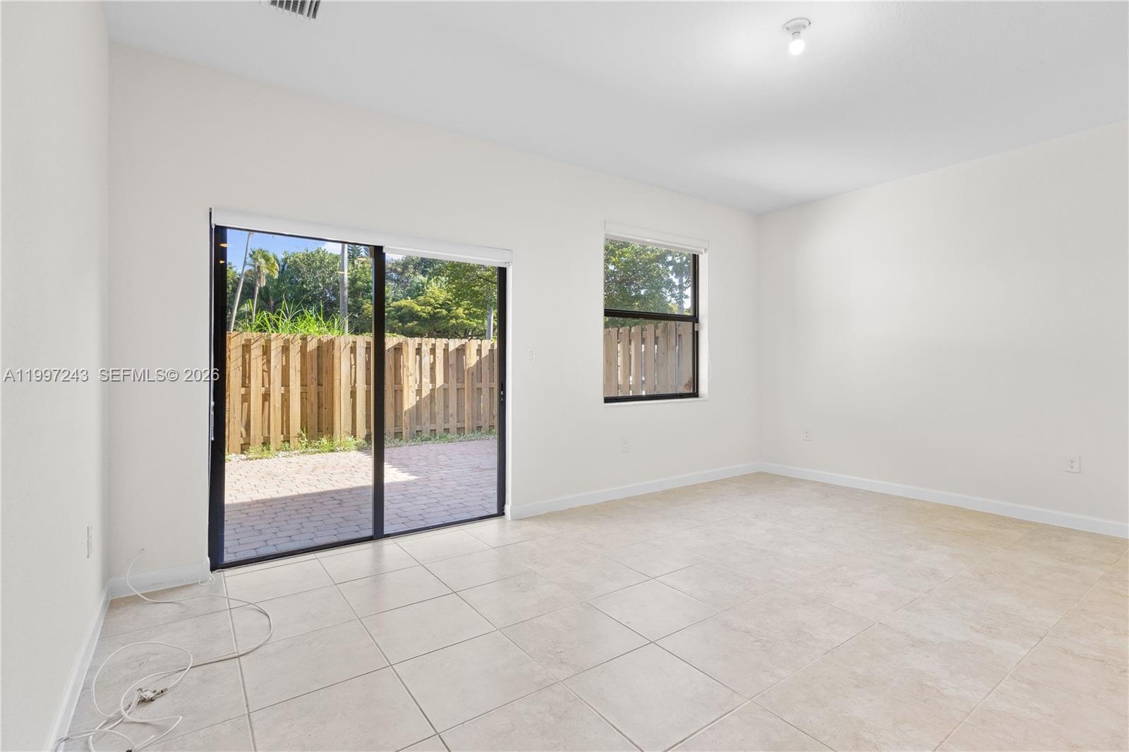 15075 Southwest 113th Terrace Miami, FL 33196 - Photo 15 of 36 an empty room with windows