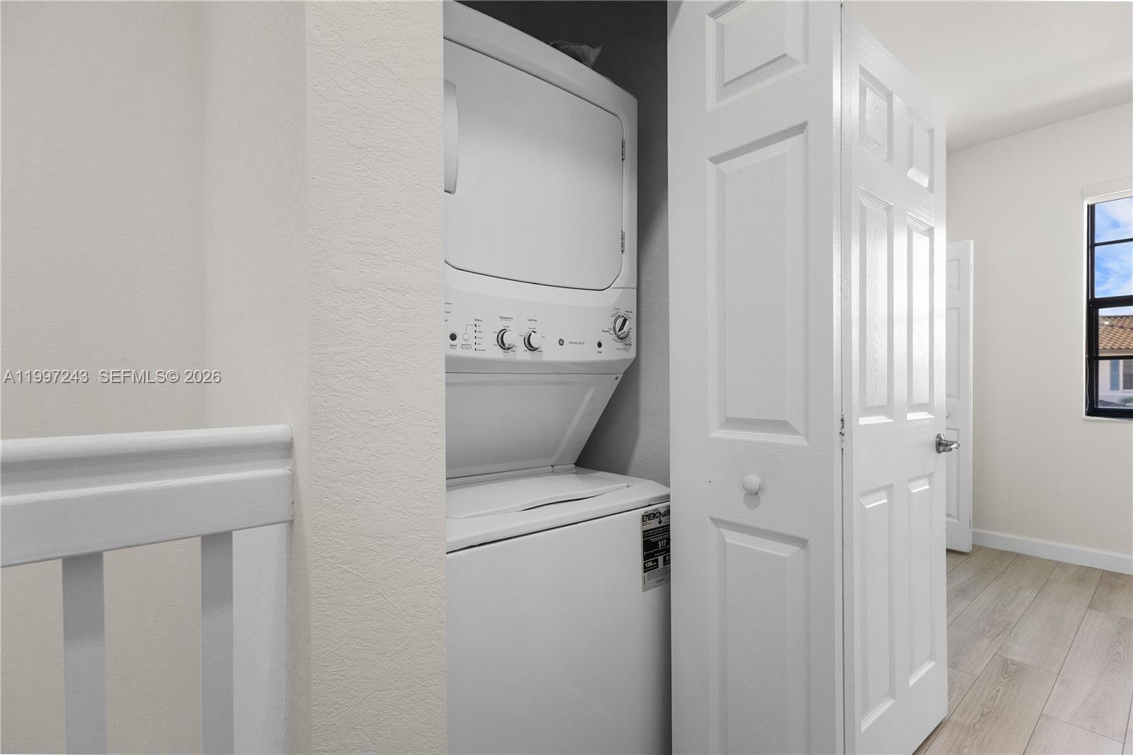 15075 Southwest 113th Terrace Miami, FL 33196 - Photo 19 of 36 a utility room with dryer and washer