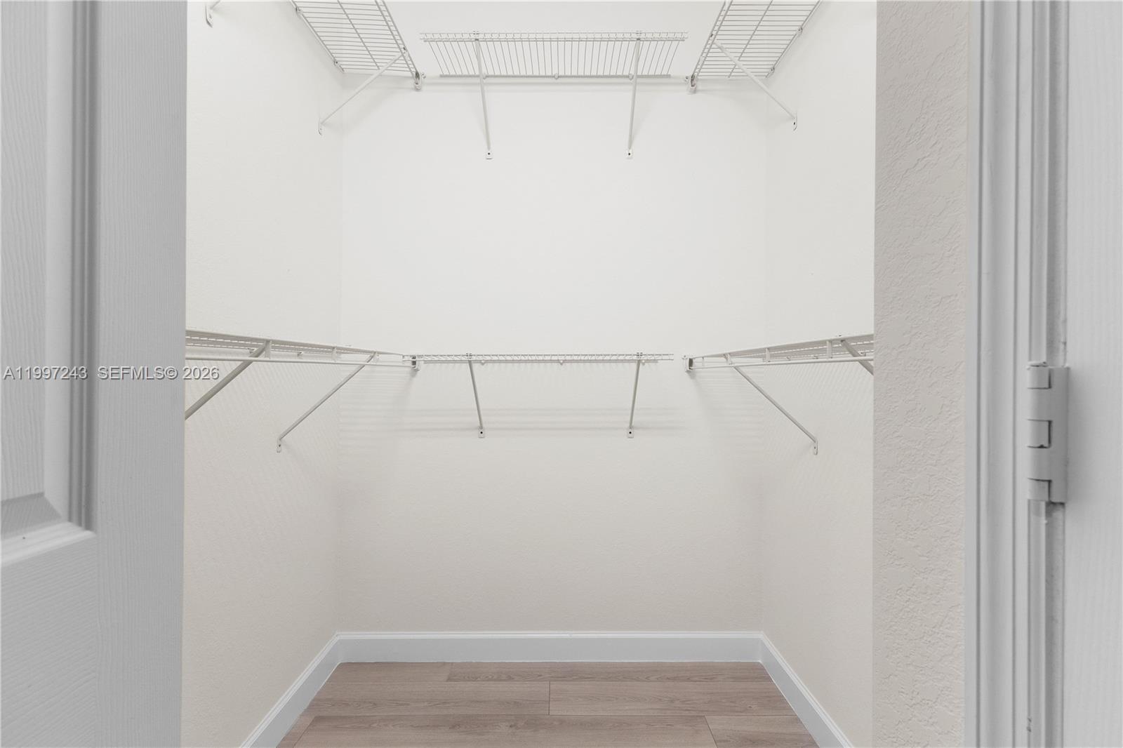 15075 Southwest 113th Terrace Miami, FL 33196 - Photo 23 of 36 a view of small space with racks on the wall