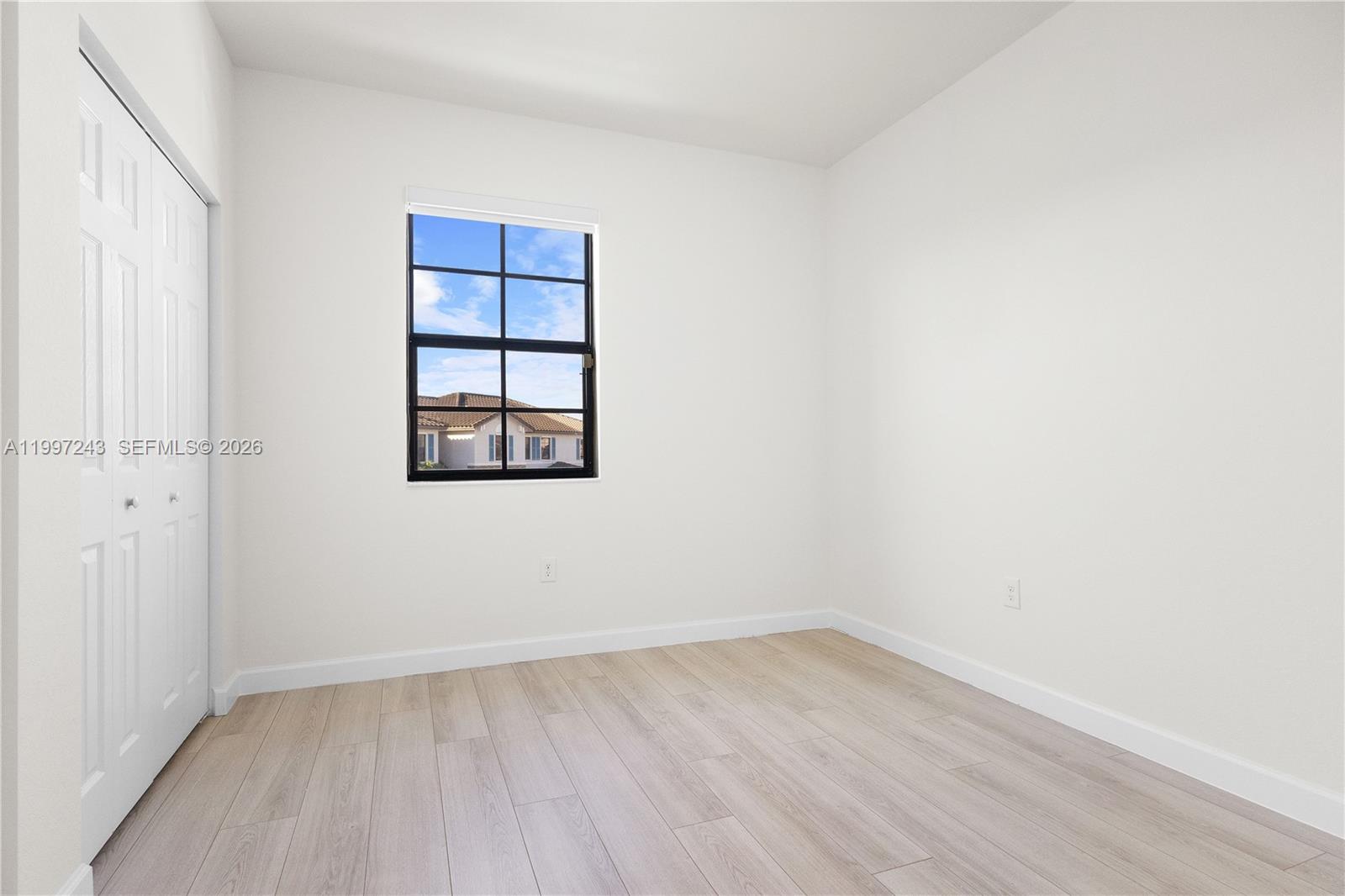 15075 Southwest 113th Terrace Miami, FL 33196 - Photo 31 of 36 an empty room with a window