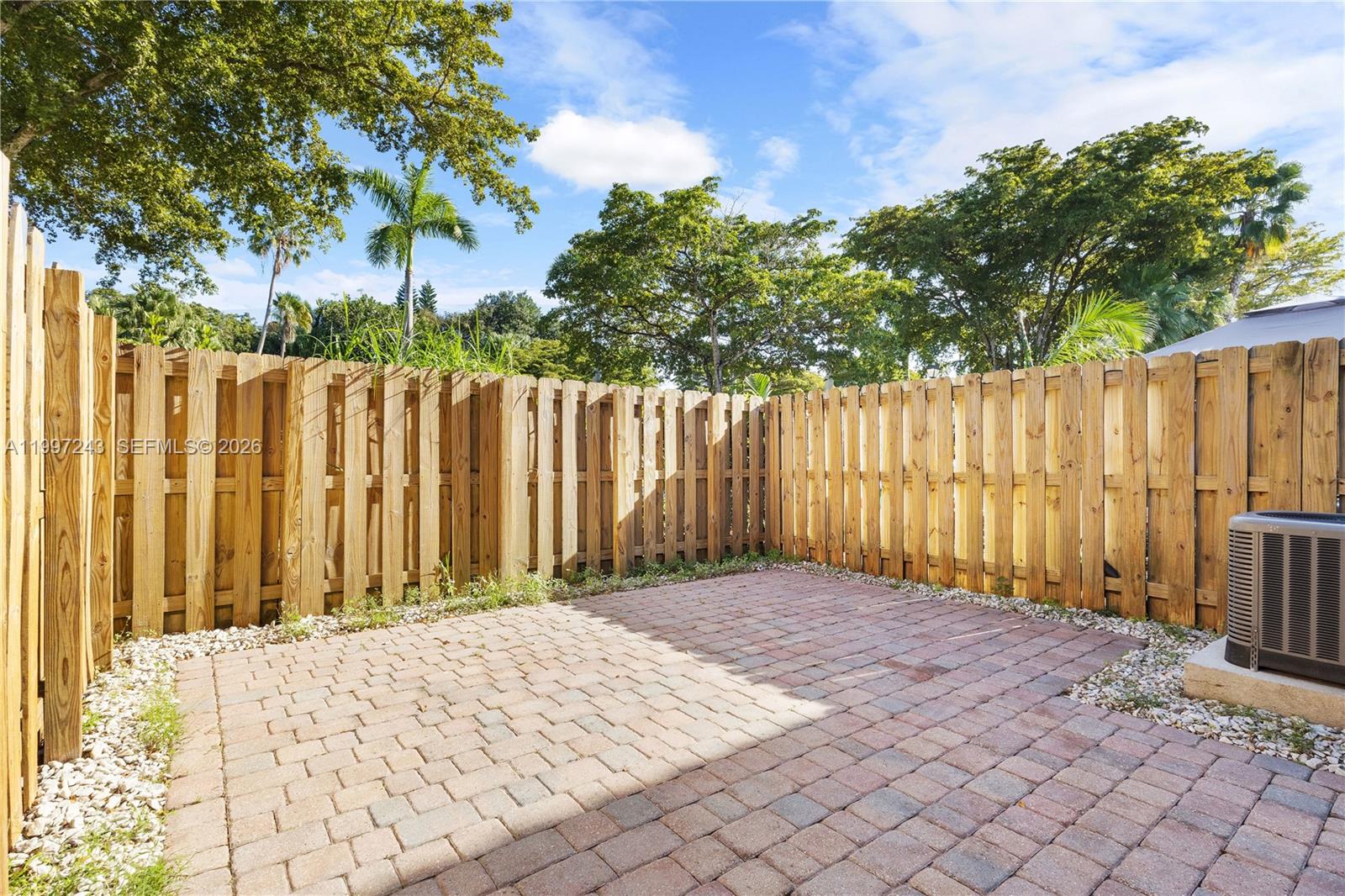 15075 Southwest 113th Terrace Miami, FL 33196 - Photo 32 of 36 a view of backyard with wooden fence