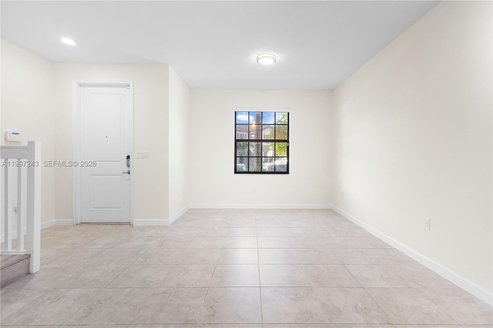 15075 Southwest 113th Terrace Miami, FL 33196 - Photo 4 of 36 an empty room with windows